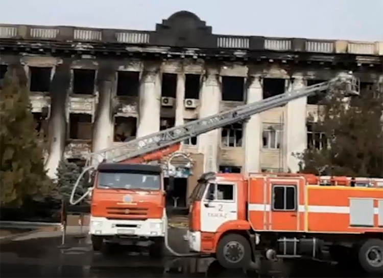 сожженное здание партии Нур тан в городе Тараз Казахстан